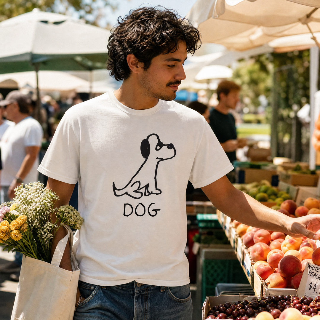 Man carrying a tote bag at a farmers market wearing a lo-fi Dog Classic Tee