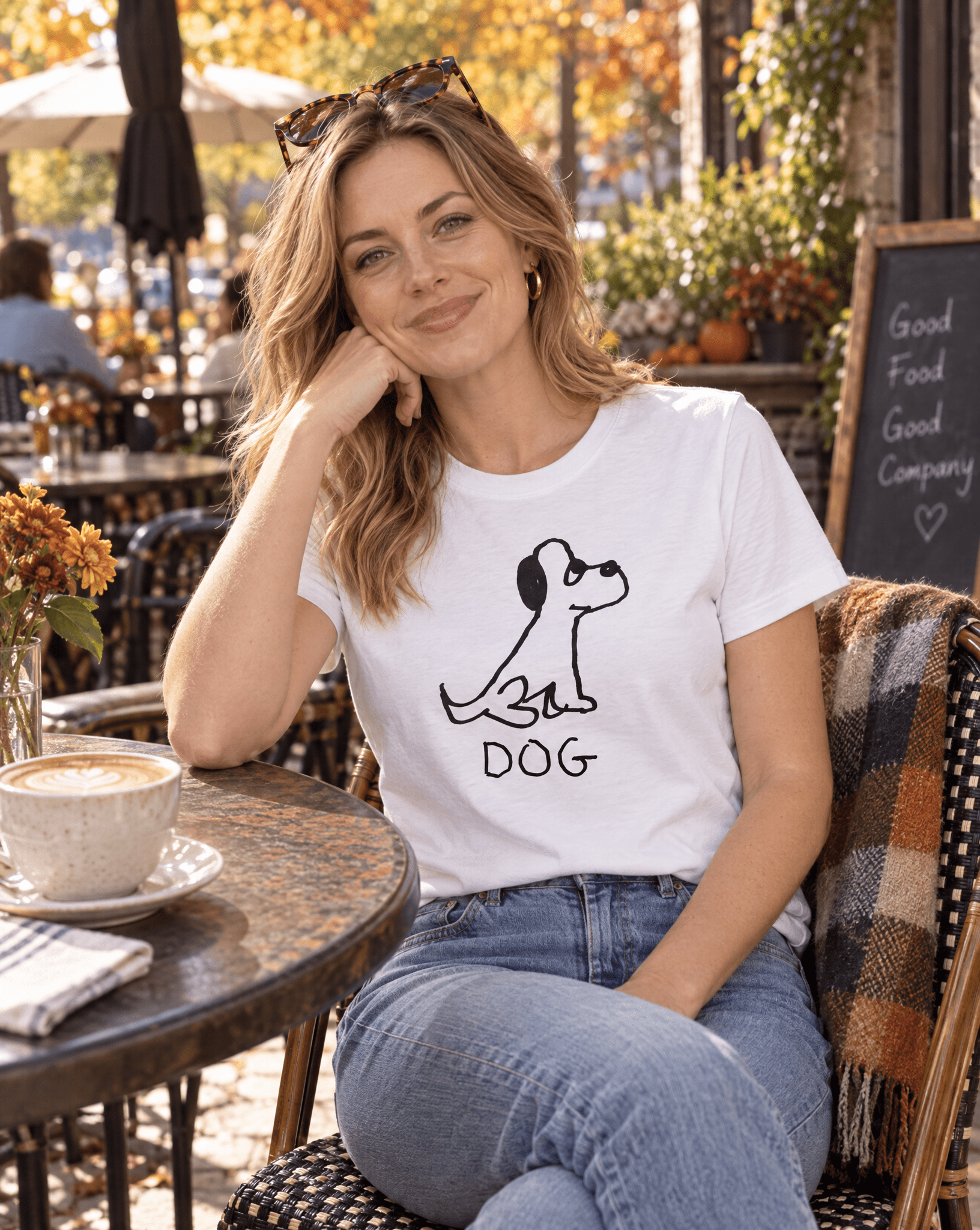Sep 29 dog women's tee — autumn patio lifestyle photo