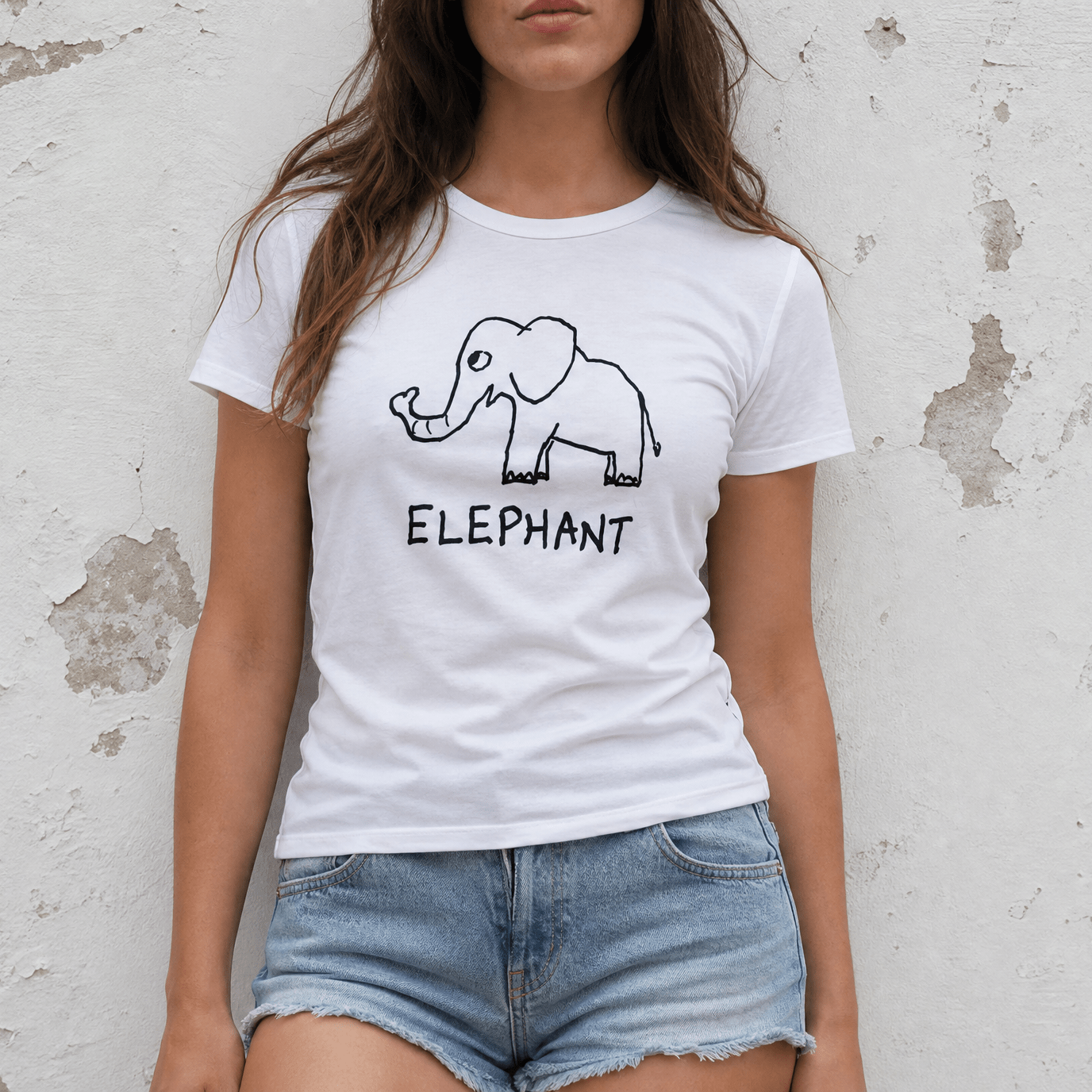 Studio torso view of a woman wearing a lo-fi Elephant Women's Relaxed Tee