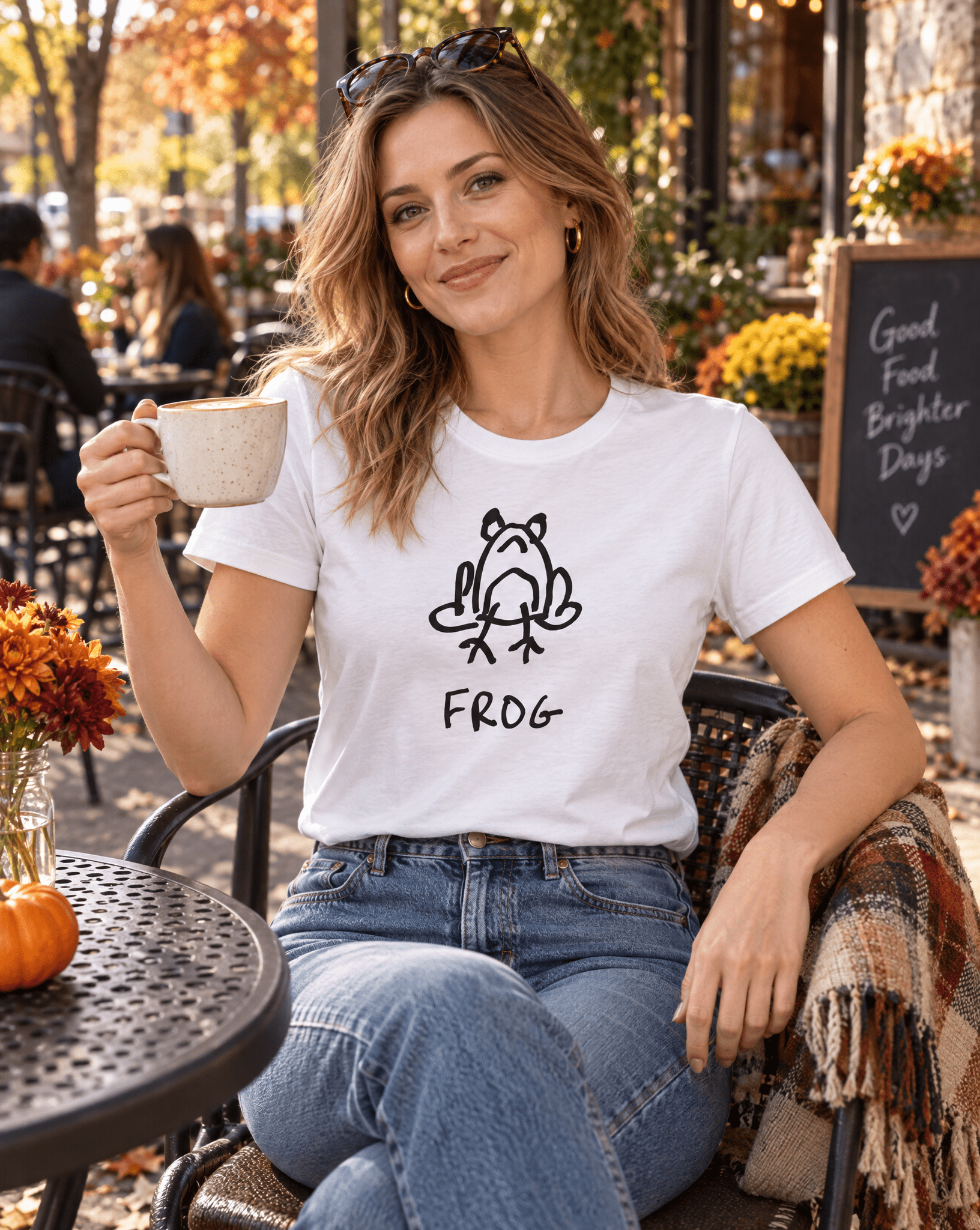 Sep 29 frog women's tee — autumn patio lifestyle photo