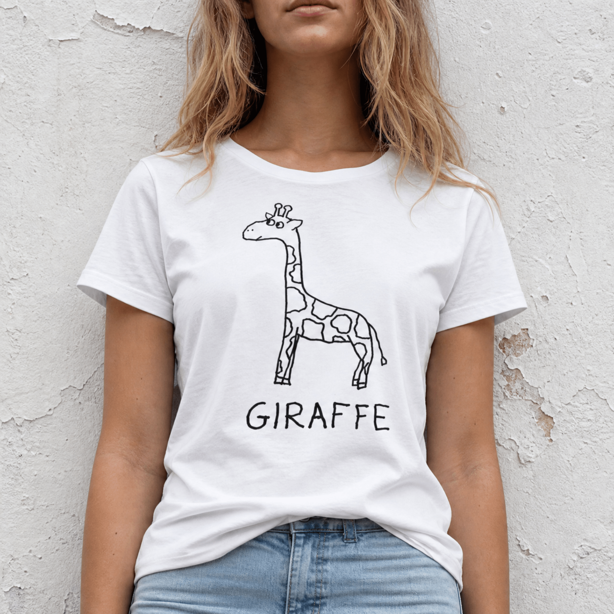 Torso shot of a woman wearing a lo-fi Giraffe Women's Relaxed T-Shirt in white