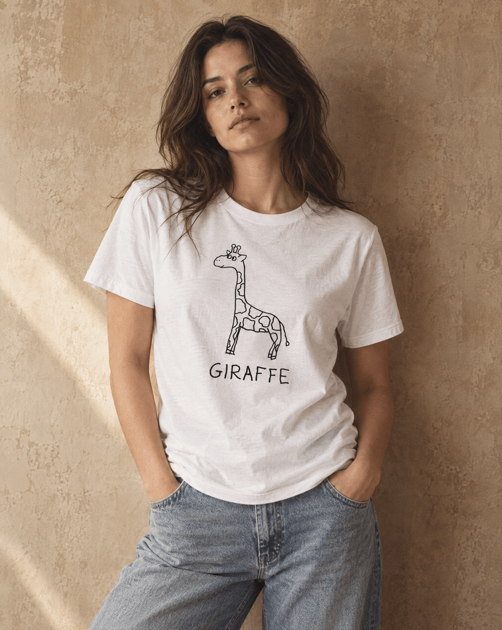 Sep 29 giraffe women's tee — studio portrait lifestyle photo