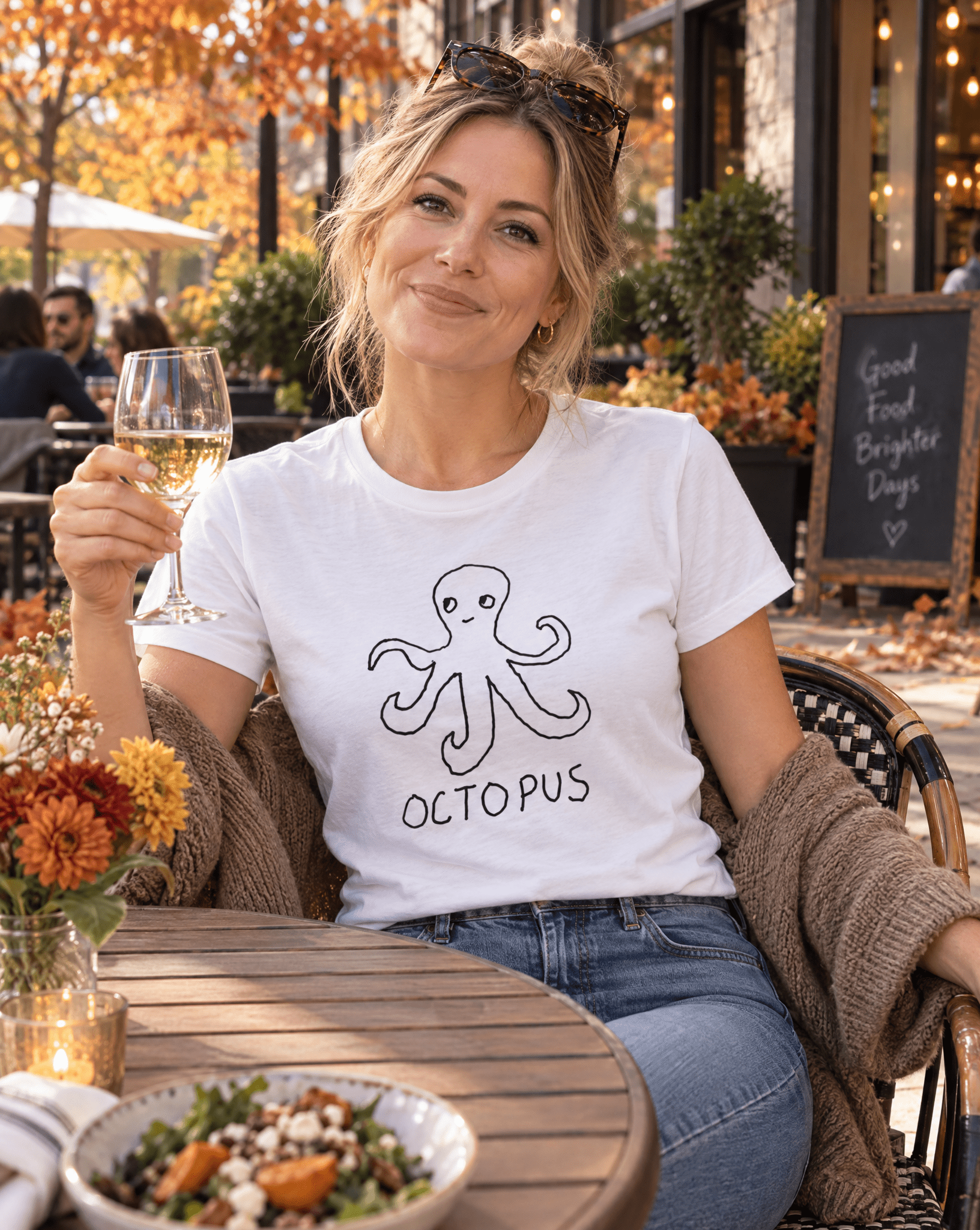 Sep 29 octopus women's tee — autumn patio lifestyle photo