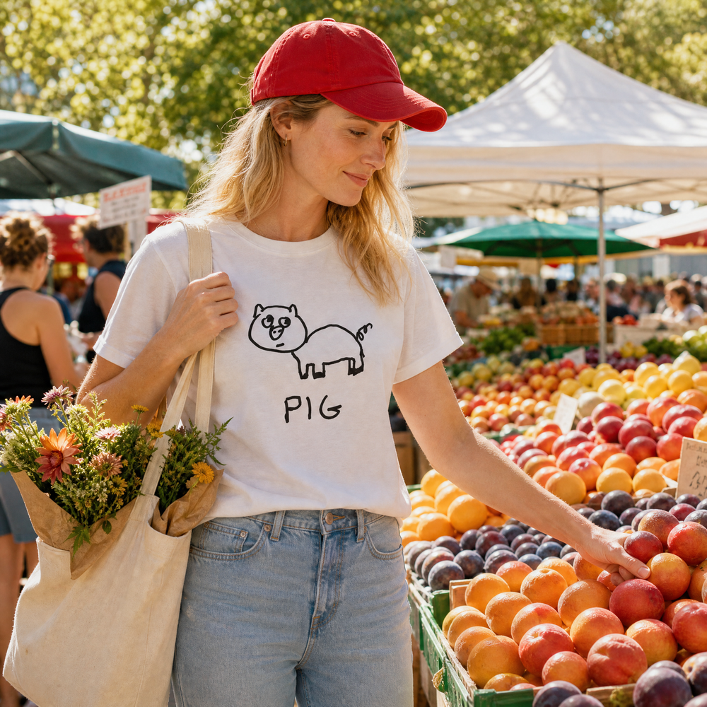 Woman in a red cap at a farmers market wearing a lo-fi Pig Classic Tee