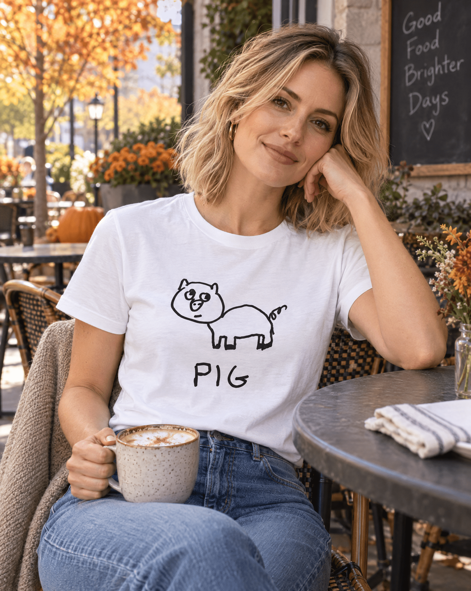 Sep 29 pig women's tee — autumn patio lifestyle photo