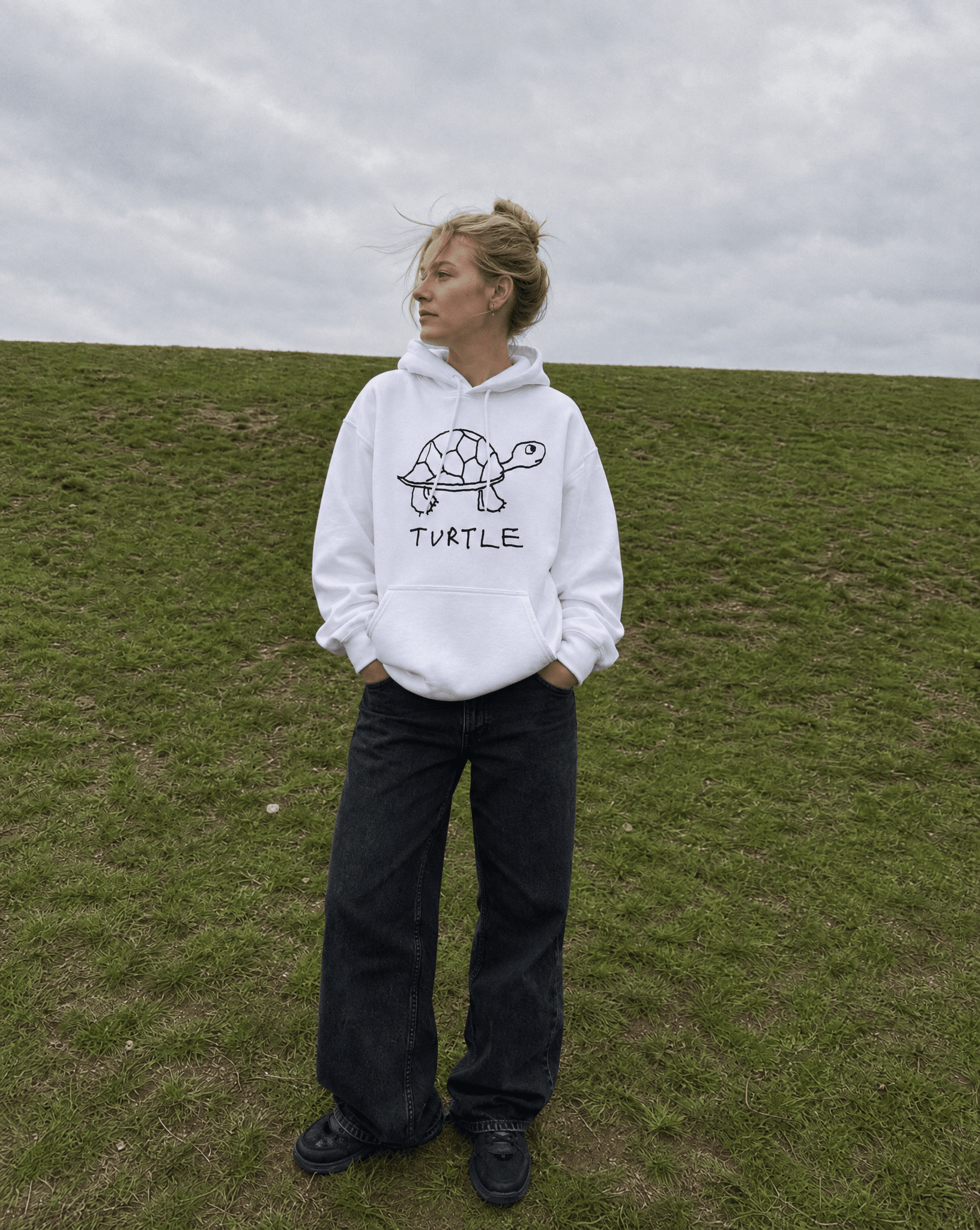 LoFi Turtle Hoodie lifestyle photo — grassy hill
