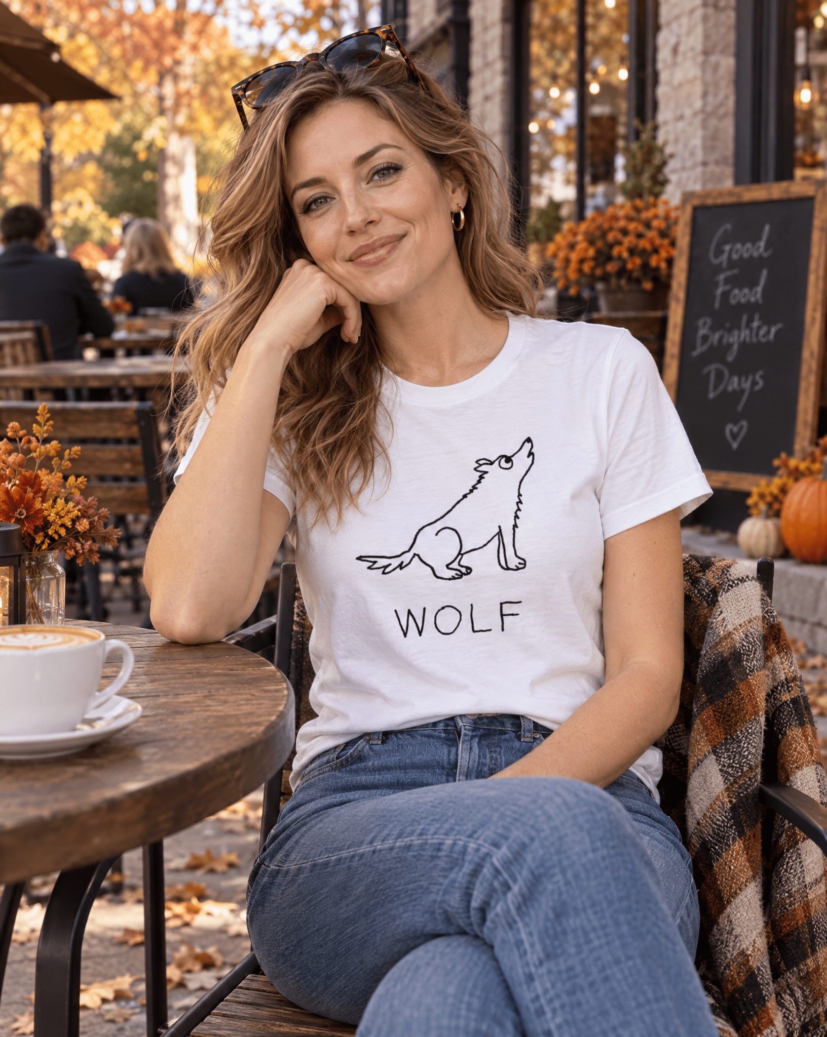 Sep 29 wolf women's tee — autumn patio lifestyle photo