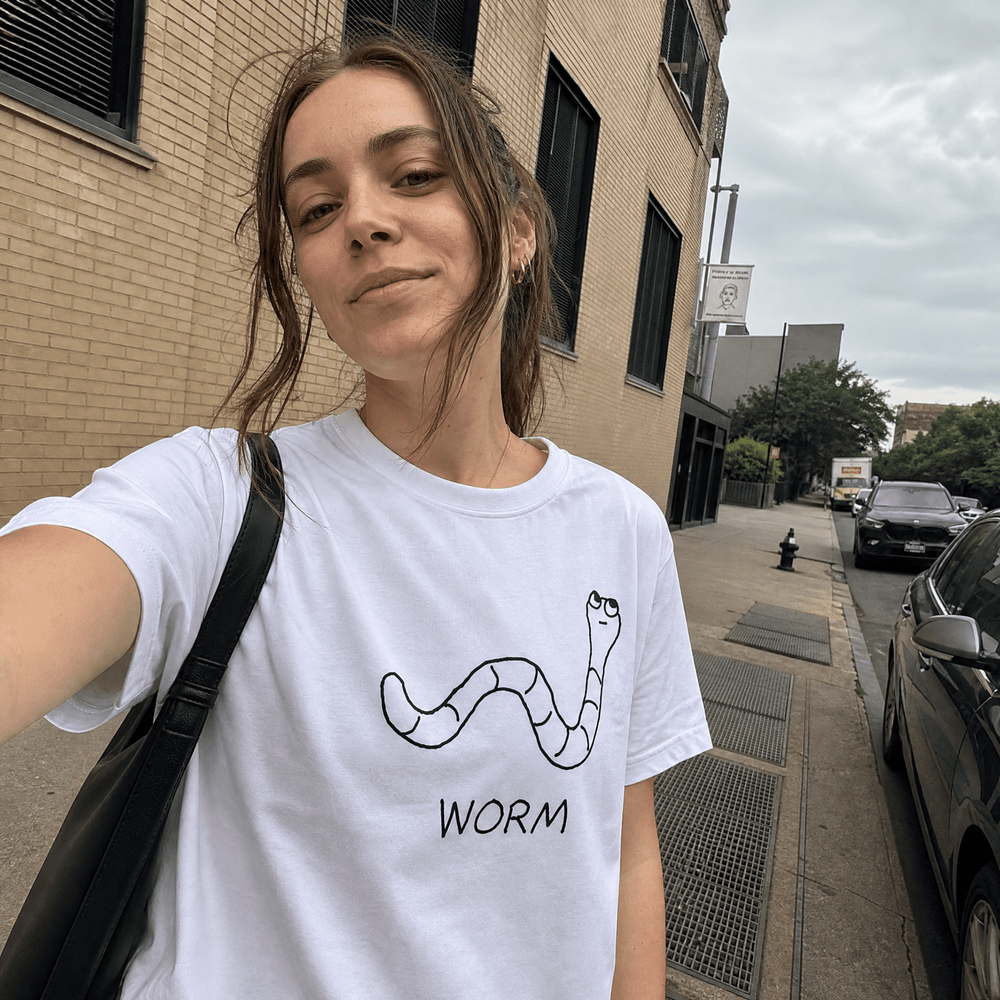 Woman taking a street selfie in a lo-fi Worm Women's Relaxed T-Shirt in white