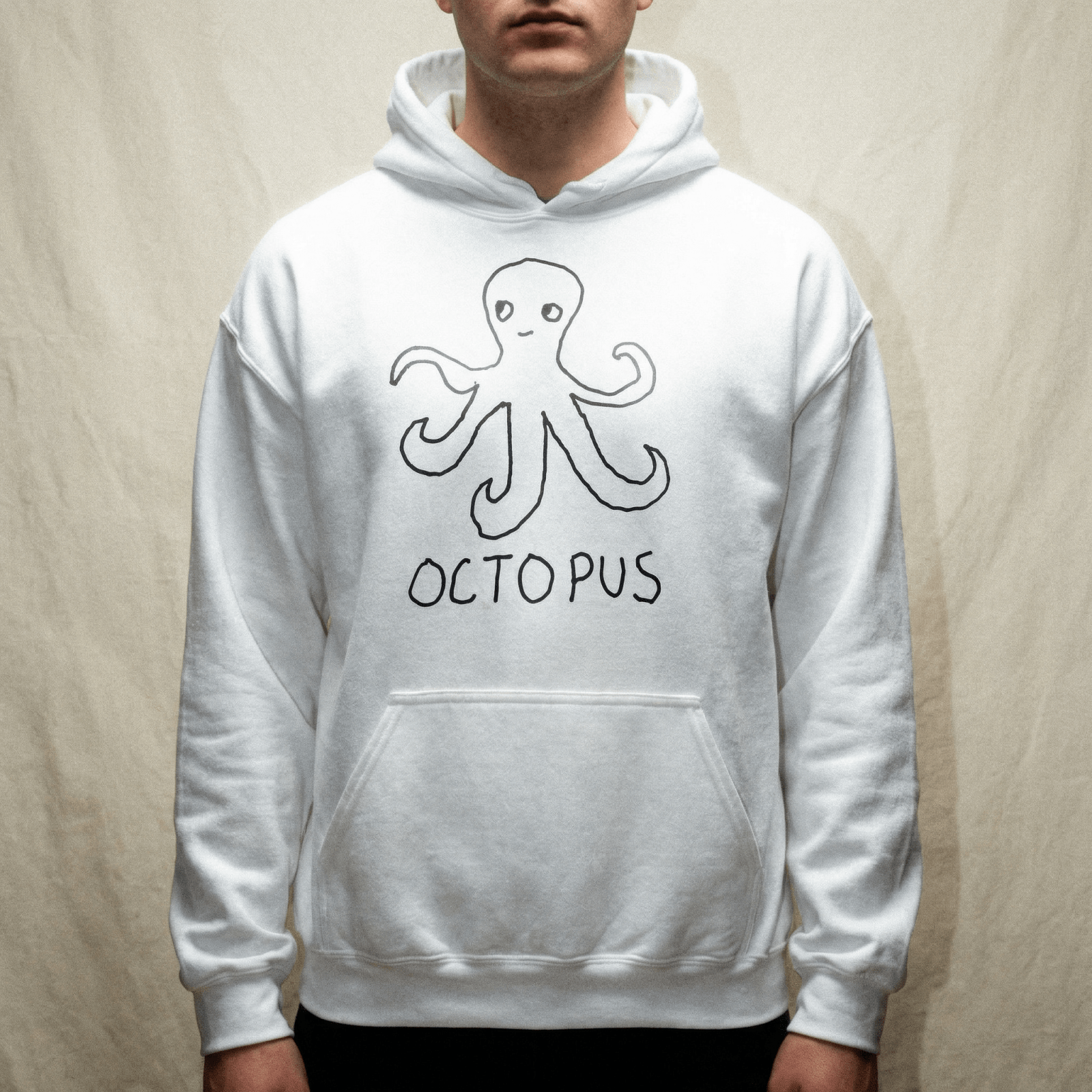 Man wearing a lo-fi Octopus Hoodie in white against a neutral studio backdrop