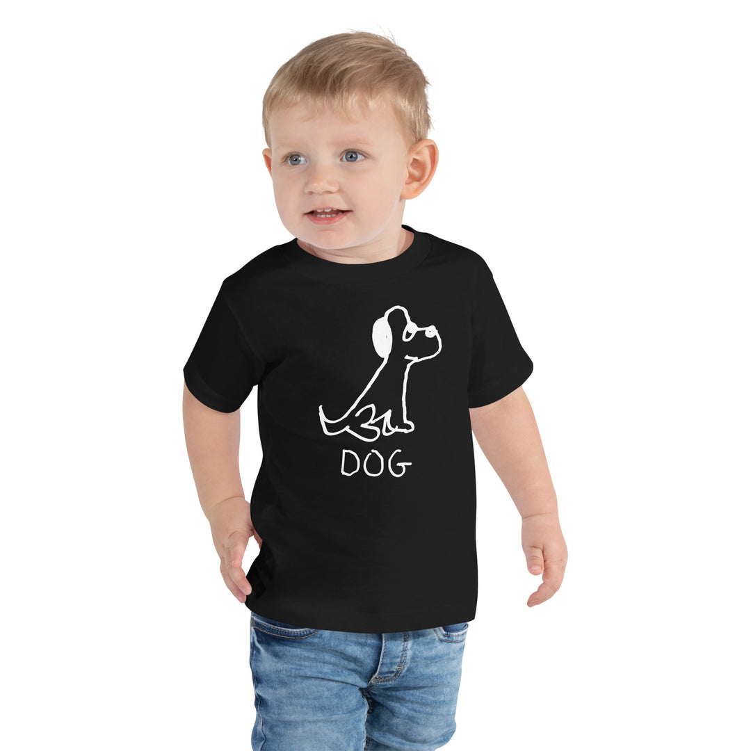 Toddler wearing a black toddler t-shirt with a lo-fi hand-drawn dog illustration and &