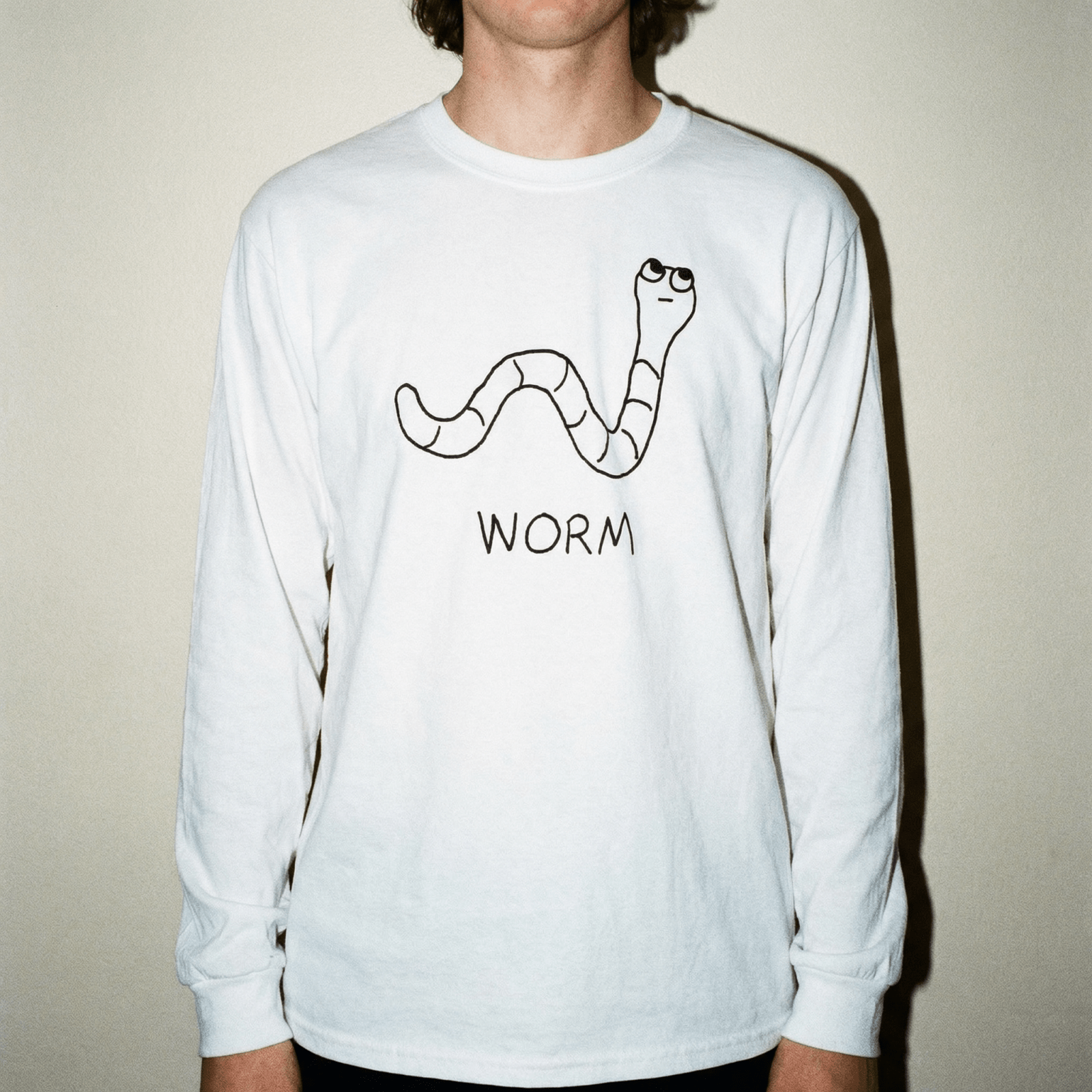 lo-fi Worm Long Sleeve Tee — hand-drawn worm graphic on a white long-sleeve t-shirt