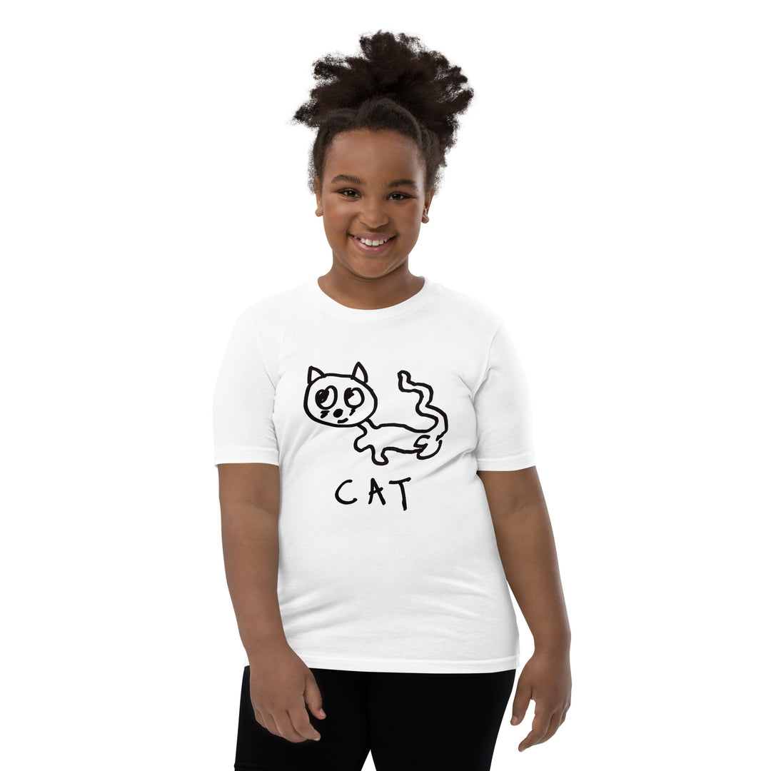 Child wearing a white t-shirt with simple hand drawn cat illustration and "CAT" text on a white background